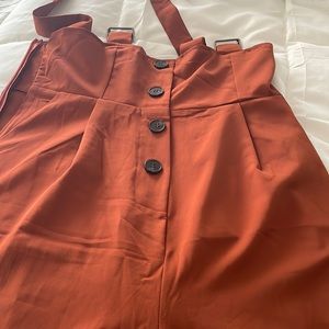 Very hard to get a great picture! Very cute suspender pants with buttons -